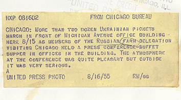 1955, August 15. HB. Chicago, Illinois. More than two dozen Ukrainian pickets march in front of Michigan Avenue office building here 8/15 as members of the Russian farm delegation visiting Chicago held a press conference-buffet supper in offices in the building. The atmosphere at the conference was quite pleasant but outside it was very serious. United Press Photo (Back)