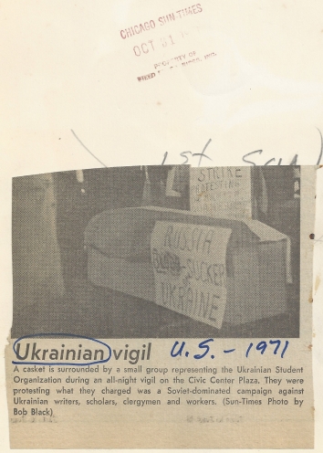 1971, October 30. FB. Chicago, Illinois. A casket is surrounded by a small group representing the Ukrainian Student Organization during an all-night vigil on the Civic Center Plaza. They were protesting what they charged was a Soviet-dominated campaign against Ukrainian writers, scholars, clergymen and workers. Chicago Sun-Times (Back)