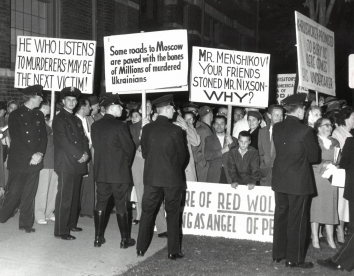 1958, October 18. CA. Milwaukee, Wisconsin. Brandishing placards, a booing ant catcalling crowd expressed its disapproval of Russian Ambassador Mikhail A. Menshikov's appearance Friday night at the Woman's Club of Wisconsin, 813 E. Kilbourn av (Front)
