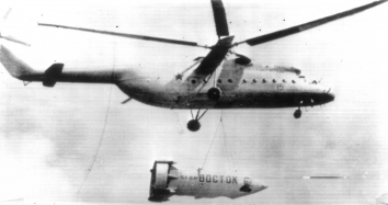 1961, July 9. FA. Moscow, Soviet Russia. A giant helicopter Mi-6 carries "Vostok," Gagarin's space capsule (or its replica) during air parade 7/9. UPI Radiotelephoto (Front)
