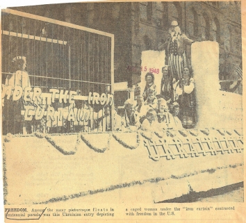 1948, August 15. AB. FREEDOM. Among the many picturesque floats in Centennial parade was this Ukrainian entry depicting a caged woman under the 