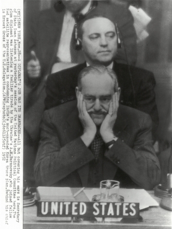 1952, November 28. CA. New York, New York. A DIPLOMAT'S JOB HAS ITS DRAWBACKS -  Secretary of State Dean Acheson listening to Ukraine's A.M.Baranovsky at UN Political Committee session. AP Wirephoto (Front)