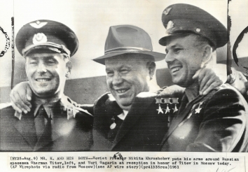 1961, August 9. GA. Moscow, Soviet Russia. MR  K  AND HIS BOYS - Soviet Premier Nikita Khrushchev puts his arms around Russian spacemen Gherman Titov, left, and Yuri Gagarin at reception in honor Titov in Moscow today. AP Wirephoto (Front)