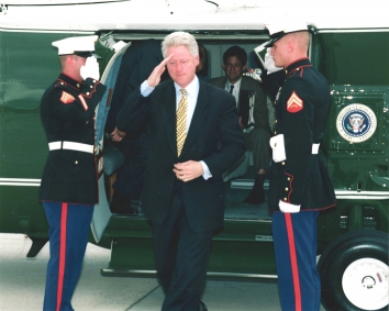 1999, June 2. BA. Colorado Springs, Colorado. President Bill Clinton salutes as he exits Marine One, a UH-60 Black Hawk Helicopter (produced by Sikorsky Aircrafts) at Peterson Air Force Base in Colorado. Here President Clinton delivered the commencement address to the Air Force Academy. In his remarks, the President announced a new deployment of 48 U.S. aircraft to Operation Allied Force, and a commitment of 7,000 U.S. troops to KFOR, an international security force for Kosovo. He outlined NATO's strategy for reversing Milosevic's ethnic cleansing campaign and restoring peace to the Balkans. Photo by SSGT Alex Lloyd, USAF