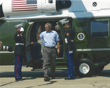 2005, September 2. BA. Biloxi, Mississippi. President George W. Bush renders a salute as he exits the VH-60N helicopter (produced by Sikorsky Aircraft), Marine One, of Special Air Mission Squadron One (HMX-1) at Kessler Air Force Base (AFB), Mississippi (MS). President Bush is enroute to a tour of the Biloxi area to view the devastation of Hurricane Katrina after the category-4 hurricane battered the Gulf Coast with wind gusts in excess of 140 miles per hour, leaving millions of people without power, and hundreds of thousands homeless. Phot by TSGT Mike Buytas, USAF