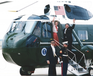 1985, February 7. AA. Joint Base Andrews, Maryland. President Ronald W. Reagan and First Lady Nancy Reagan prepare to depart the flight line aboard Marine One, a Sikorsky VH-3D Sea King helicopter from Marine Helicopter Squadron 1. They are leaving the base after participating in a ceremony honoring former TWA hostages upon their return to the U.S. The 39 U.S. citizens had been held captive for 16 days in Beirut, Lebanon, by Shiite Moslem terrorists. Photo by MSGT Ken Hammond
