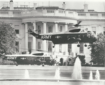 1964, May 22. BA. Washington, District of Columbia. TAKEOFF TIME AT WHITE HOUSE. President Johnson's helicopter [Marine One Sikorsky VH-3] waits for takeoff today on the south lawn of the White House as the Secret Service 'copter [Sikorsky VH-3] climbs for the first leg of a flight to Detroit. The President flew to nearby Andrews Air Force Base and then boarded a jet for the remainder of the flight. AP Wirephoto (Front)